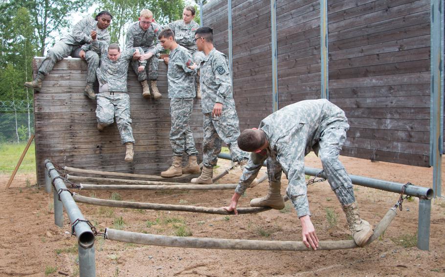 Teamwork was the key to success as more than 100 Junior ROTC cadets from across the Department of Defense Education Activity-Europe school system took on a series of obstacles at the leadership-reaction course in Grafenwoehr, Germany, on June 18, 2015.