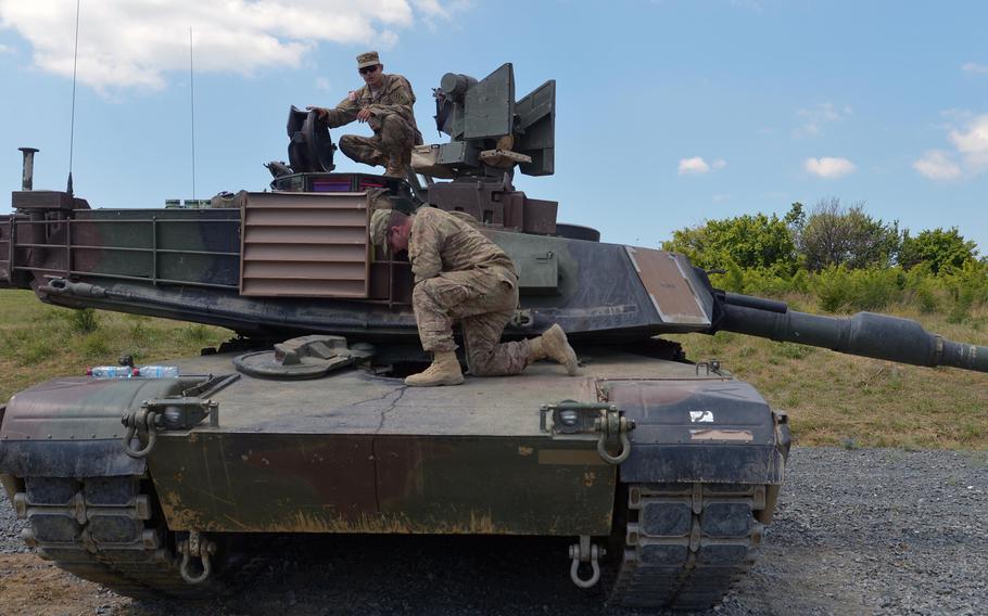 Cpl. Craig Ochocki, top, and Spc. Seth Lanz, prepare to turn the turret of their M1A2 Abrams tank at the Novo Selo Training Area, Bulgaria, on June 24, 2015. The soldiers of the 3rd Infantry Division's 3rd Combined Arms Battalion, 69th Armored Regiment, out of Fort Stewart, Ga. and another M1A2 were in Bulgaria for a live-fire exercise on Thursday.