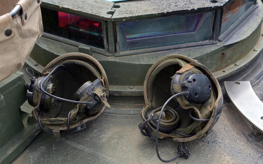 A pair of tanker helmets sit on the turret of an Abrams tank at the Novo Selo Training Area in Bulgaria, Wednesday, June 24, 2015, as its crew from the 3rd Infantry Division?s 3rd Combined Arms Battalion, 69th Armored Regiment out of Fort Stewart, Ga., prepares the tank for Thursday's live-fire demonstration.

Michael Abrams/Stars and Stripes