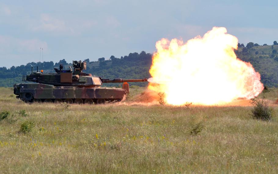 A M1A2 Abrams tank, crewed by soldiers from the 3rd Infantry Division's 3rd Combined Arms Battalion, 69th Armored Regiment out of Fort Stewart, Ga., fire a practice round at the Novo Selo Training Area in Bulgaria, on June 24, 2015, ahead of tomorrow's live-fire demonstration.