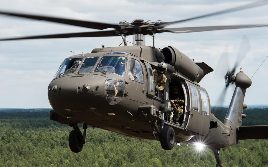 American and Czech soldiers prepare to land to airlift and transport a simulated prisoner of war during an air assualt raid at the Zagan Military Training Area, Poland, during NATO Exercise Noble Jump on June 16, 2015. The alliance has voted to give its military commander the power to call on the spearhead force at a moment's notice, but actual deployment still requires the approval of the National Security Council.