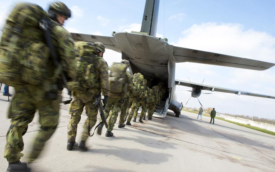 Czech Soldiers from the 43rd Airborne Battalion, 2nd Company load onto a CASA C-295 aircraft during Exercise Noble Jump at the Pardubice Airfield, Czech Republic, on April 9, 2015. Exercise Noble Jump marks the first time that high-readiness units have physically tested their response to rapid "orders to move" under the new VJTF framework. 