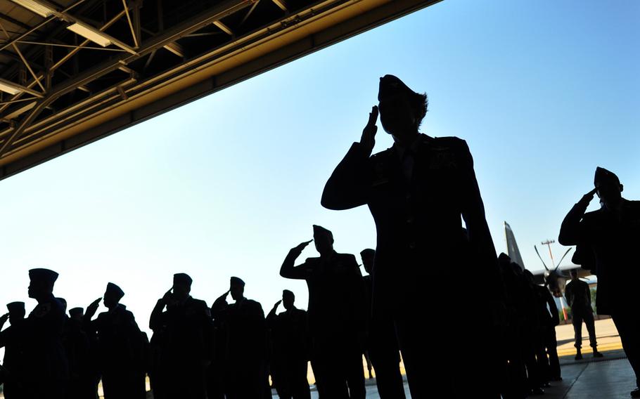 Airmen of 3rd Air Force render a first salute to their new commander Thursday, July 2, 2015, during a change of command ceremony at Ramstein Air Base.