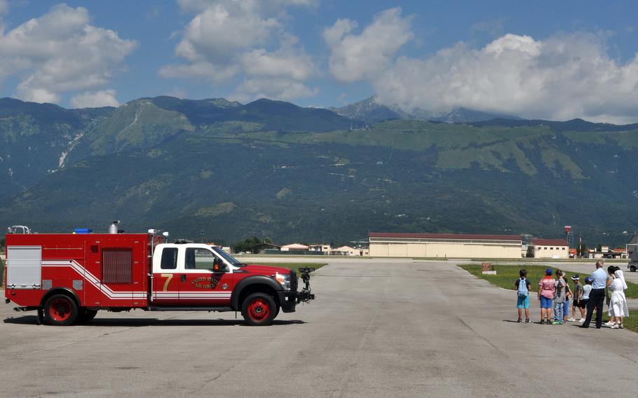 A group from a foster and day care center in Porcia, Italy,  watch for a fighter jet to take off at Aviano Air Base, Italy.