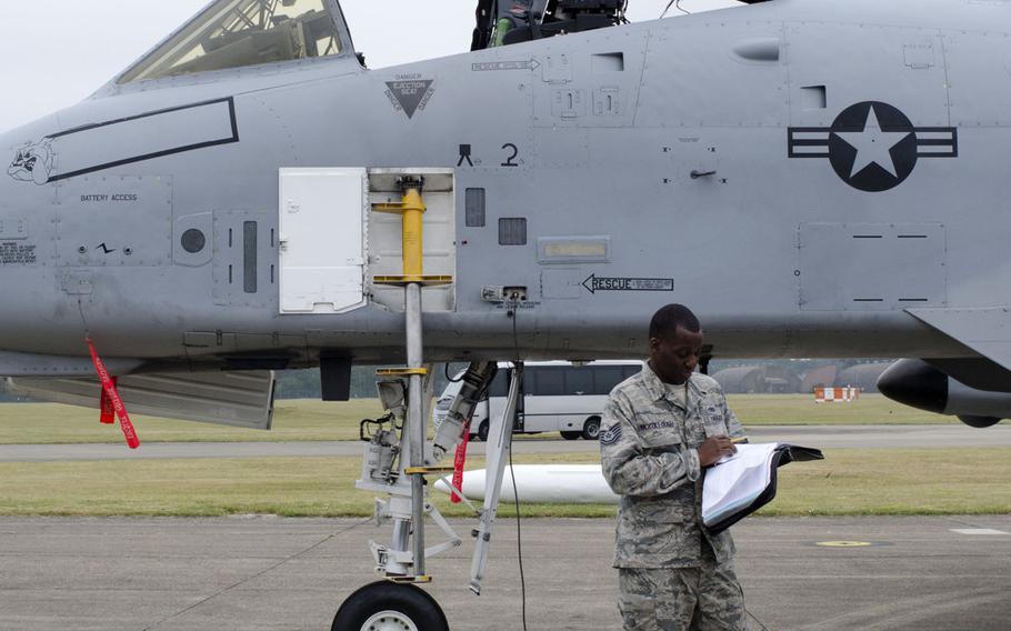 A U.S. airmAn prepares an A-10 Thunderbolt II for takeoff at RAF Lakenheath, England, on Wednesday, July 16, 2015. The U.S. deployed 12 A-10s to Europe earlier this year, and the planes have stopped at various bases throughout the Continent.