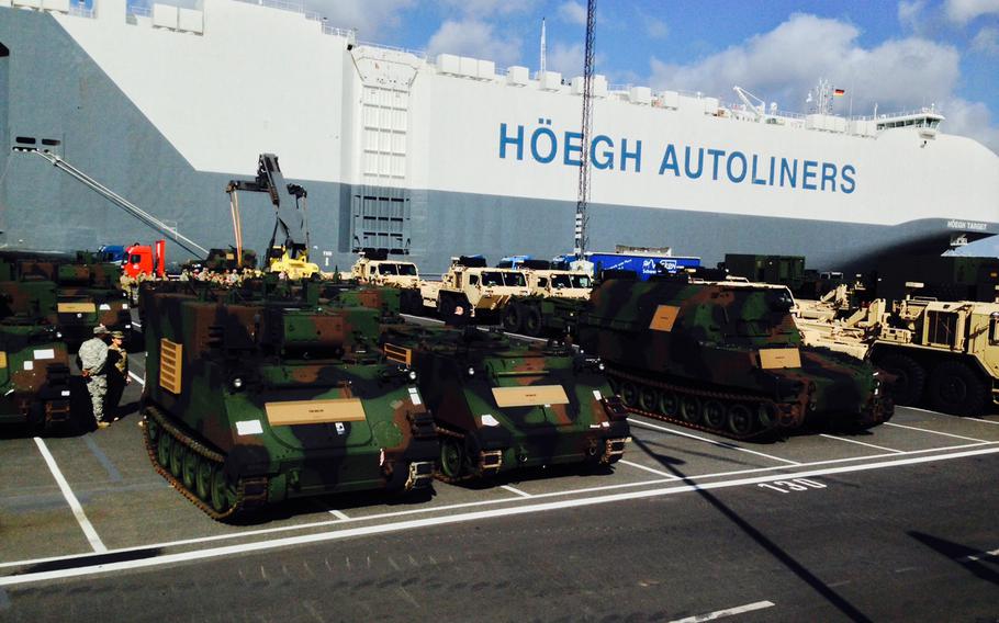 Military vehicles are lined up for transport at the port in Bremerhaven, Germany, a major hub for moving gear into and out of Europe. During a three- day Terrain Walk through locations in Germany, Latvia and Poland, Army leaders looked at ways to speed up the movement of equipment in Europe.