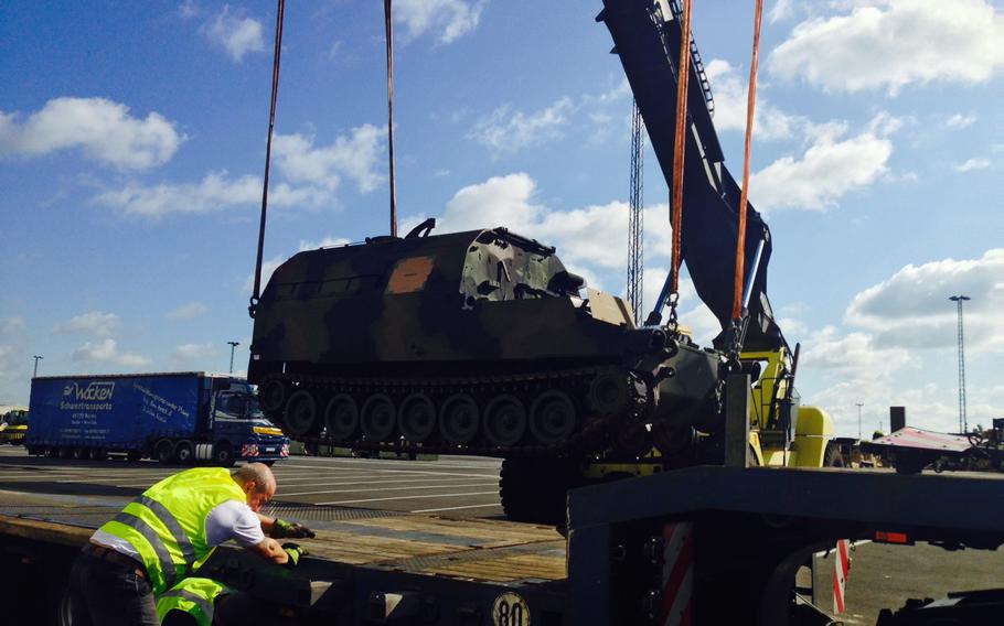 An ammunition loading truck gets moved for transport at the port in Bremerhaven, Germany, Wednesday, Sept. 2, 2015. The vehicle is part of the European Activity Set, which includes about 250 heavy vehicles and 800 other tactical vehicles.