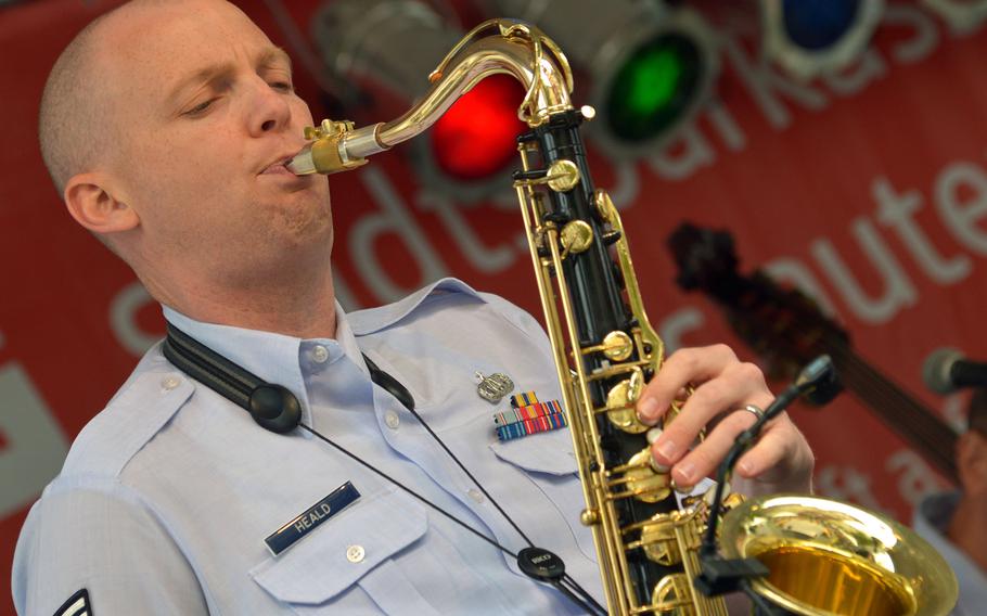 Staff Sgt. Nathan Heald of the USAFE Band's Wings of Dixie ensemble solos on sax during the band's set at Swinging Lautern in downtown Kaiserslautern, Germany, Friday, Sept. 4, 2015.