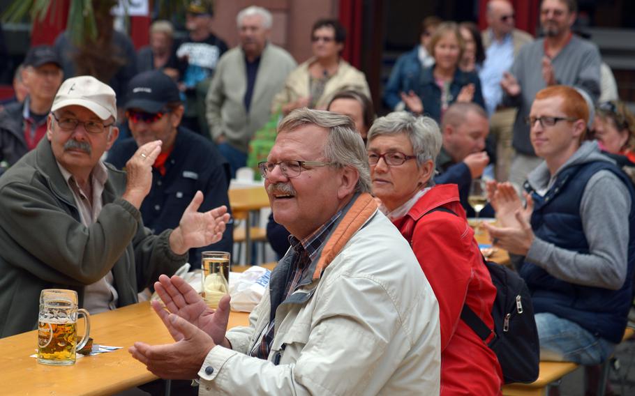 The crowd claps to the rhythm during a performance by the USAFE Band's Wings of Dixie ensemble at Swinging Lautern in downtown Kaiserslautern, Germany, Friday, Sept. 4, 2015.