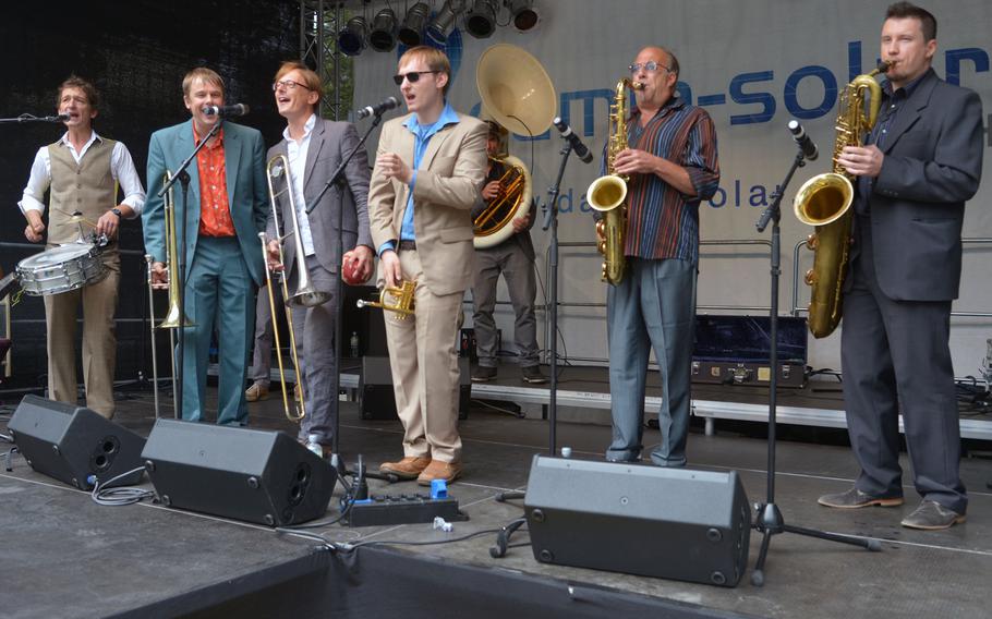 The Top Dog Brass Band entertains listeners during their set at Swinging Lautern in downtown Kaiserslautern, Germany, Friday, Sept. 4, 2015.
