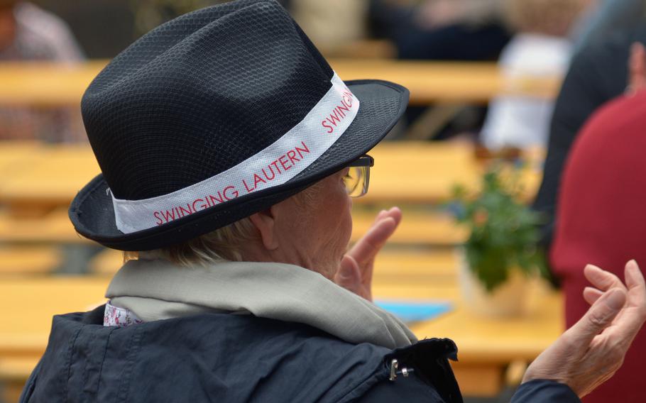 A listener claps to the music during the annual Swinging Lautern jazz festival in downtown Kaiserslautern, Germany, Friday Sept. 4, 2015. The souvenir hat costs five euros.
