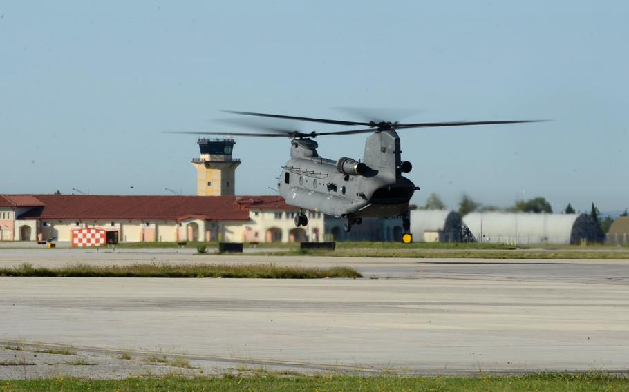 A Dutch Chinook helicopter hovers above the runway at Aviano Air Base, Italy, before flying a two-hour sortie Tuesday, Sept. 8, 2015.