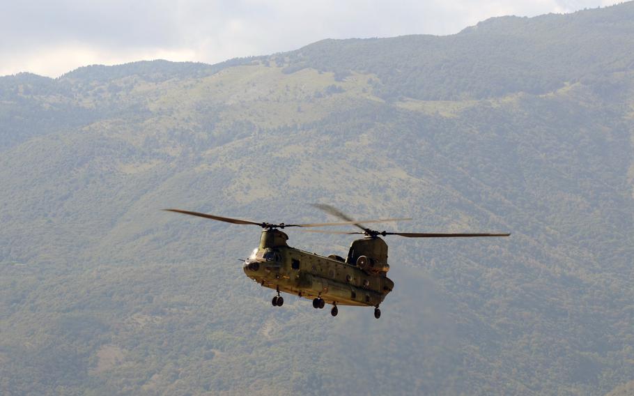 A Dutch Chinook helicopter hovers near Aviano Air Base, Italy, as part of training to enhance general combat skills for new and veteran pilots Tuesday, Sept. 8, 2015.