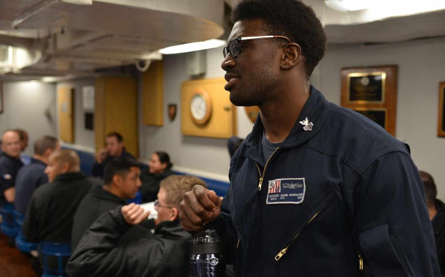Petty Officer 1st Class Daniel Rainmaker, a crewmember aboard the guided missile destroyer USS Carney, is pictured on Sept. 23, 2015, wearing one of two flame-resistant coverall prototypes - the flight suit variant - being tested by crewmembers for the Navy.