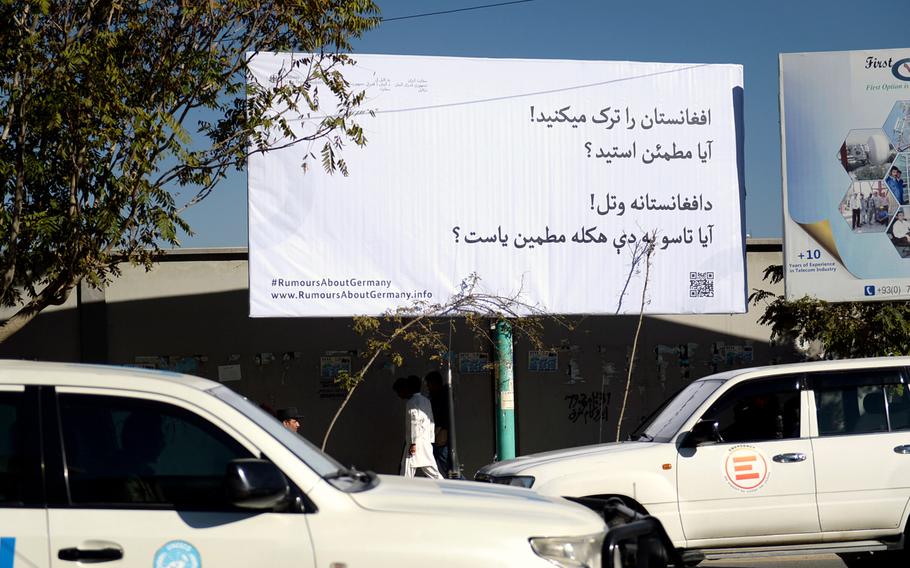 A billboard placed by the German Embassy in Kabul on Sunday, Nov. 15, 2015, asks Afghans to think twice before trying to migrate to Europe. Waves of Afghans have fled to Europe trying to flee violence and economic problems.