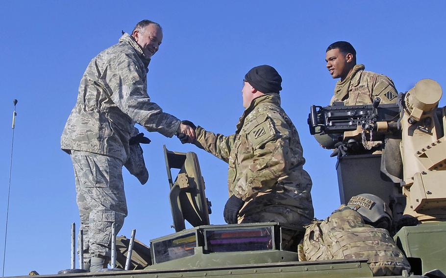 U.S. European Command's Gen. Philip Breedlove stands atop an Abrams tank to meet with U.S. soldiers taking part in training at the Zagan Training Area in Poland, Nov. 24, 2015. Breedlove made a Thanksgiving season visit to troops from the Georgia-based 3rd Infantry Division, who are serving as a rotational force across the region, including all three Baltic states.