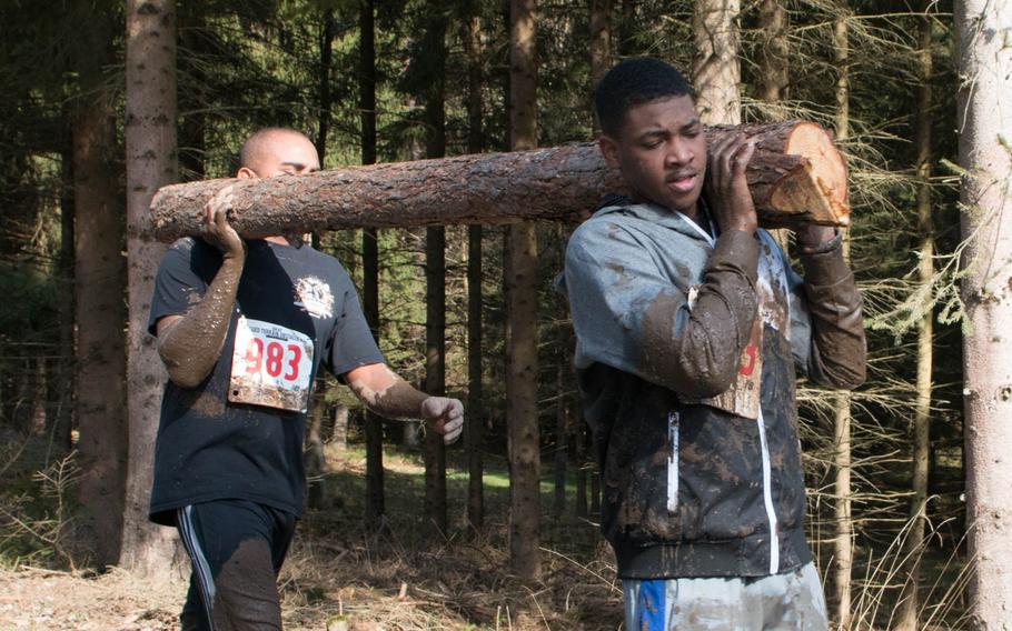 Some participants of 4th annual Grafenwoehr rugged terrain obstacle run held Saturday, April 9, 2016 in Grafenwoehr, Germany used teamwork to overcome obstacles.