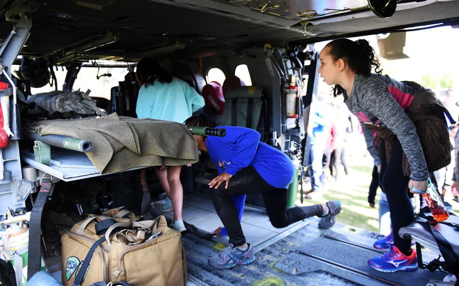 Students from the Grafenwoehr Elementary School explore the back of a UH-60 Black Hawk helicopter during a Science Technology Engineering and Math activity on base, at Grafenwoehr, Germany, Tuesday, April 30, 2019.