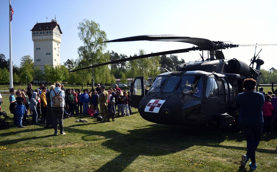 Students from the Grafenwoehr Elementary School ask questions about a UH-60 Black Hawk helicopter during a Science Technology Engineering and Math activity on base, at Grafenwoehr, Germany, Tuesday, April 30, 2019.