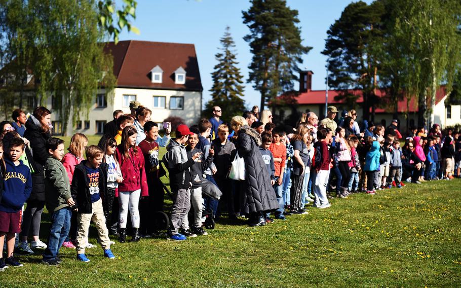 Students  watch a UH-60 Black Hawk helicopter land during a Science Technology Engineering and Math activity on base, at Grafenwoehr, Germany, Tuesday, April 30, 2019.