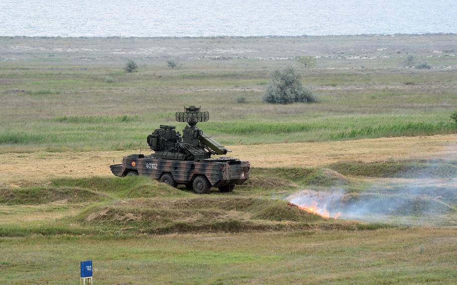 A Romanian SA-8 missile launcher with a small grass fire behind it, sparked by the missile's back blast, in Capu Midia, Romania, on Thursday, June 20, 2019.
