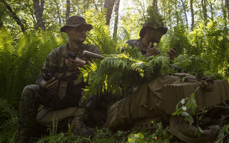 A U.S. Marine with electronic warfare liaison element and a scout sniper with Marine Rotational Force-Europe 19.2, Marine Forces Europe and Africa, prepare for a tactical extract during exercise Valhalla in Setermoen, Norway, June 17, 2019.