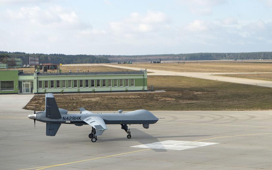 A remotely piloted MQ-9 Reaper taxis toward the runway at Miroslawiec Air Base, Poland, March 1, 2019. An unspecified number of MQ-9 Reapers, personnel and support equipment temporarily relocated to Campia Turzii Air Base, Romania, while the runway at Miroslawiec Air Base undergoes construction.