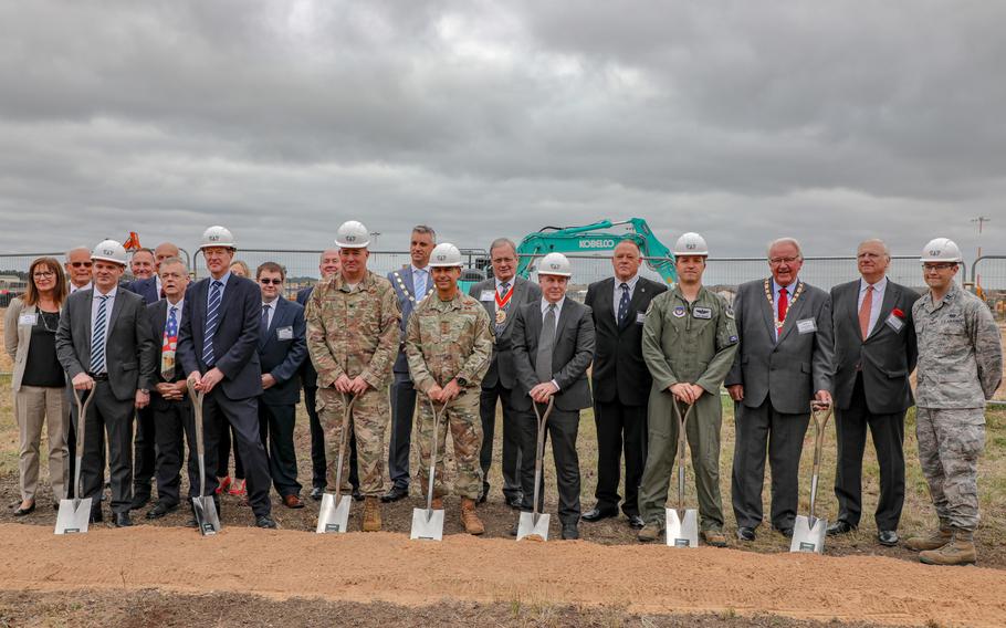 Gen. Jeffrey Harrigian, U.S. Air Forces in Europe - Air Forces Africa commander, center, and Col. Will Marshall, commander of the 48th Fighter Wing, left of Harrigan, pose for photos along with community leaders at the new F-35 Lightning II facility groundbreaking ceremony on RAF Lakenheath, Monday, July 15, 2019.