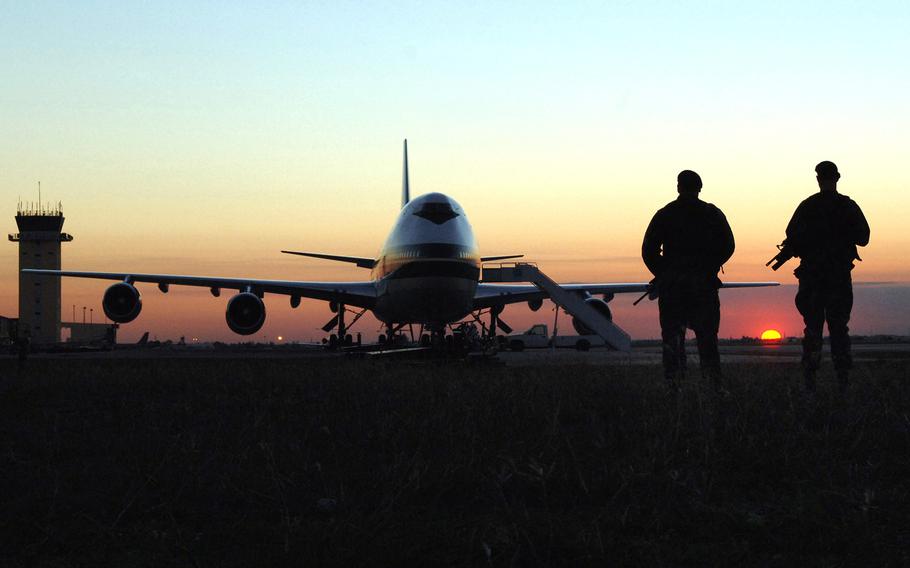 Two security forces airmen patrol the runway at Incirlik Airbase, Turkey, in 2015. 