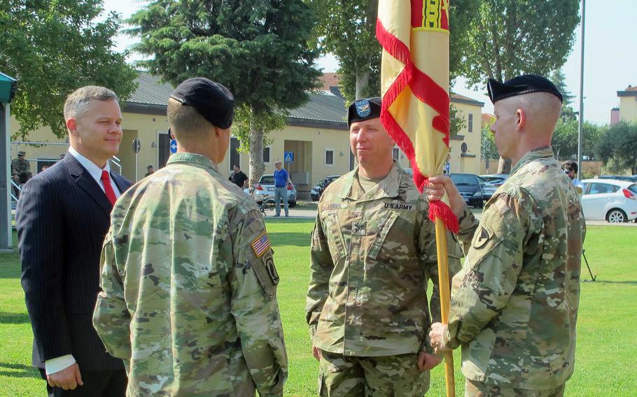 Col. Daniel Vogel, second from right, takes command of U.S. Army Garrison Italy from Col. Erik Berdy at a ceremony at Caserma Ederle in Vicenza, Italy, on Wednesday, July 24, 2019. Tommy Mize, left, director of the Installation Management Command-Europe, officiated.