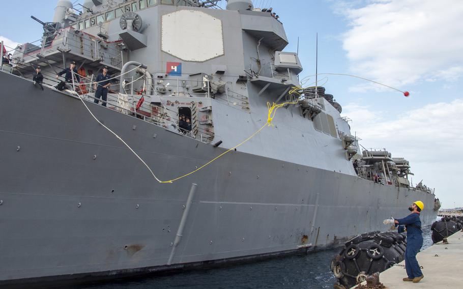 Sailors assigned to the guided-missile destroyer USS Ross cast a line as the ship moors pierside at Souda Bay, Crete, April 12, 2019. The U.S. wants to increase troop rotations into Greece.