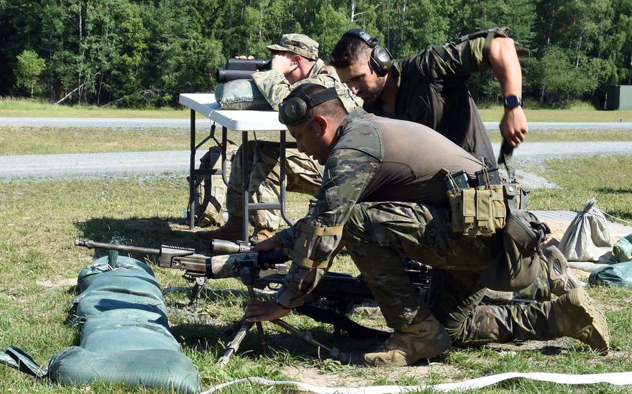 Spanish soldiers set up their position to engage targets during one of the events at the 2019 European Best Sniper Team Competition, at Grafenwoehr, Germany, Thursday, July 25, 2019.