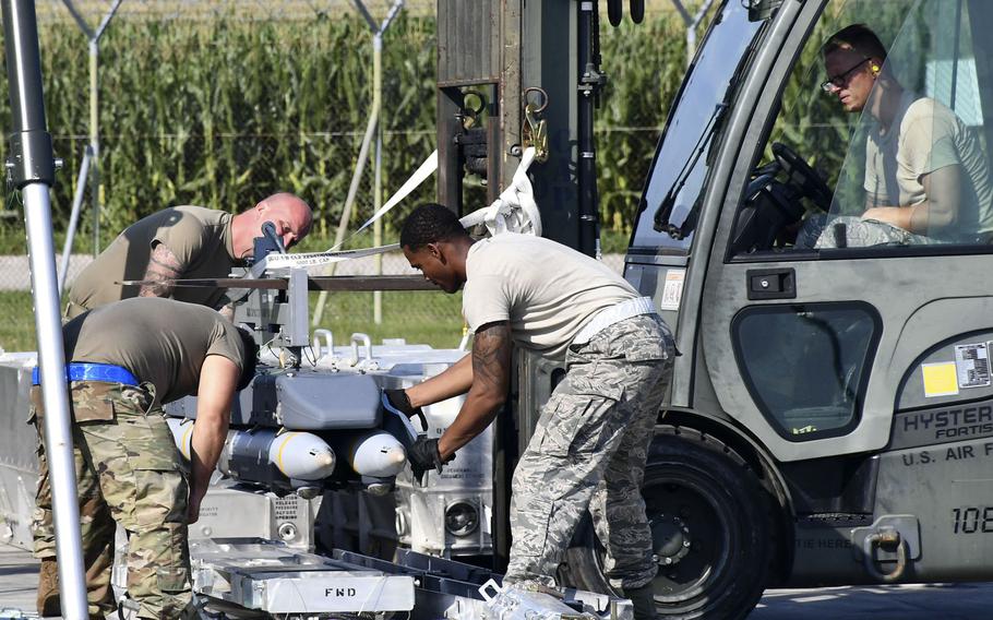 Airmen unload small-diameter bombs during the Combat Ammunition Production Exercise 2019, at Aviano Air Base, Italy, Aug. 7, 2019.