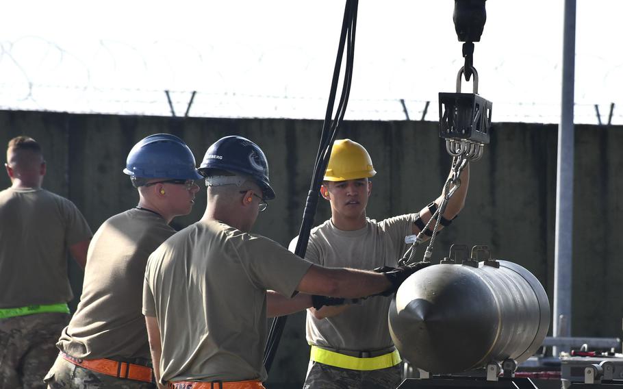 Airmen place an ammunition part on an assembly line during the Combat Ammunition Production Exercise 2019, held at Aviano Air Base, Italy, Aug. 7, 2019.