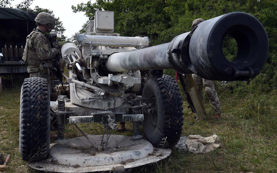 Soldiers maintain a 105mm M119-A3 howitzer during an exercise in Grafenwoehr, Germany, Aug. 13, 2019.