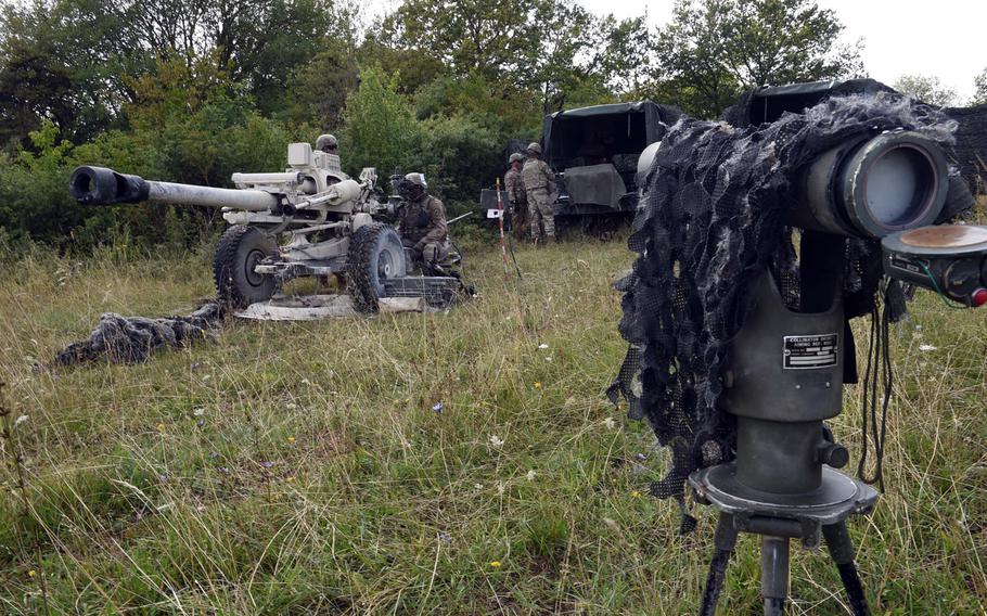 Soldiers train at an artillery firing position set up in a small clearing on the edge of a forest during an exercise in Grafenwoehr, Germany, Aug. 13, 2019.