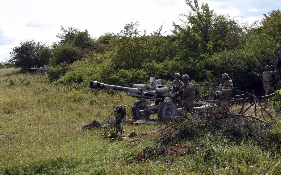 Soldiers aim their105mm M119-A3 howitzers during an exercise at Grafenwoehr, Germany, Aug. 13, 2019.