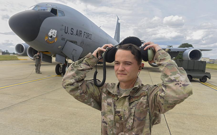 U.S. Air Force Senior Airman Joseph Finigan, 100th Aircraft Maintenance Squadron aircraft hydraulics systems journeyman, puts on a second layer of hearing protection over his dual in-ear headset at RAF Mildenhall, England, Aug. 6, 2019. The headset enables communication by transmitting sound waves through the bones in the user's ear.