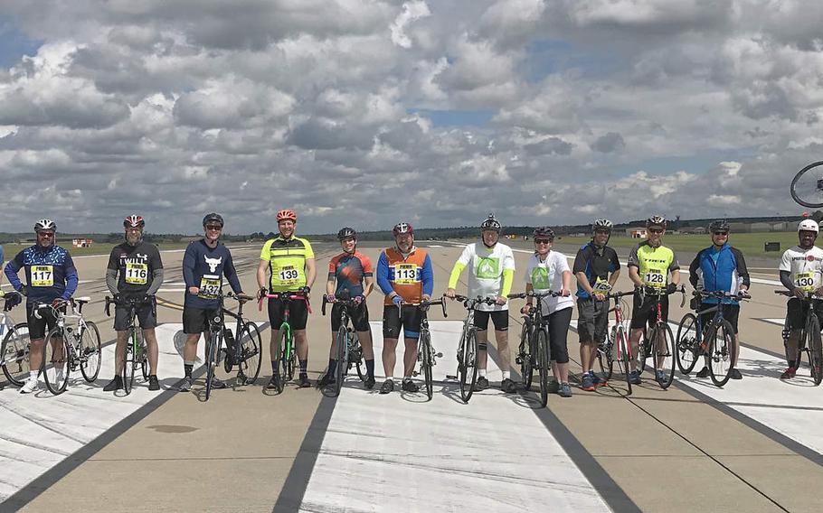 Cyclists who took part in a 24-hour ride on the flight line at RAF Lakenheath to raise awareness about suicide pose for a group shot on Saturday, June 16, 2019.