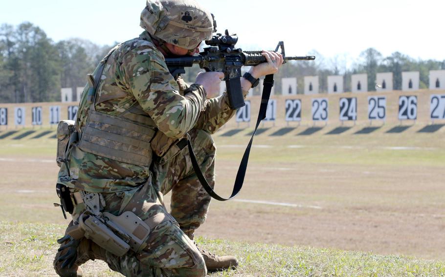 U.S. Army Sgt. 1st Class Thomas Hummel fires from the kneeling position during the 2018 U.S. Army Small Arms Championships at Fort Benning, Ga., in March 2018. The Army is revamping how soldiers train with small arm weaponry with tougher marksmanship tests.