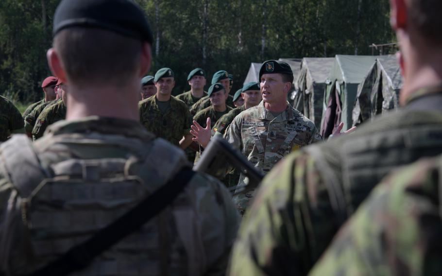 Command Sgt. Maj. Robert Abernethy of U.S. Army Europe addresses the formation during the opening ceremony of the Lithuanian Land Forces Best Infantry Squad Competition, Aug. 27, 2019, in Rukla, Lithuania.