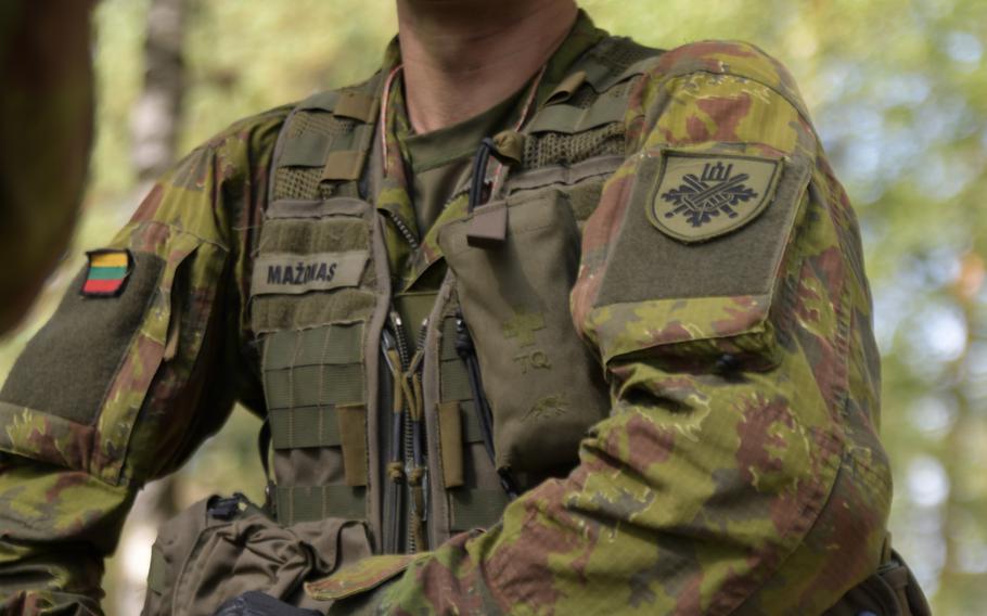 A Lithuanian soldier prepares his kit for the automatic rifle iteration during the live-fire event of the Best Infantry Squad Competition, Aug. 27, 2019, in Rukla, Lithuania.