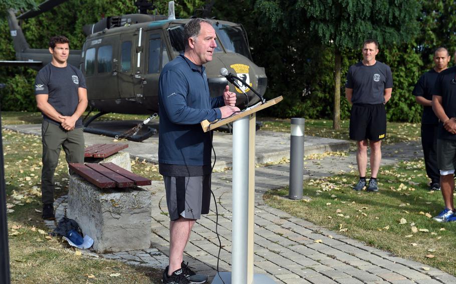 Craig Wilhelm, the former commander of "Big Windy," center, speaks to the crowd at the Windy 25 5K race at Ansbach, Germany, Sept. 6, 2019.