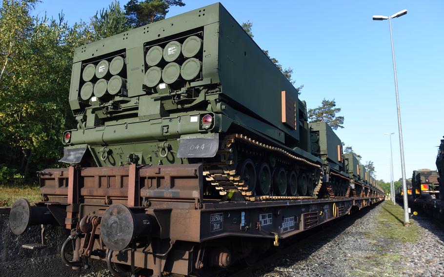 A row of M270-A1 MLRS rocket launch systems arriving on A train in Grafenwoehr, Germany, Wednesday, Sept. 11, 2019.