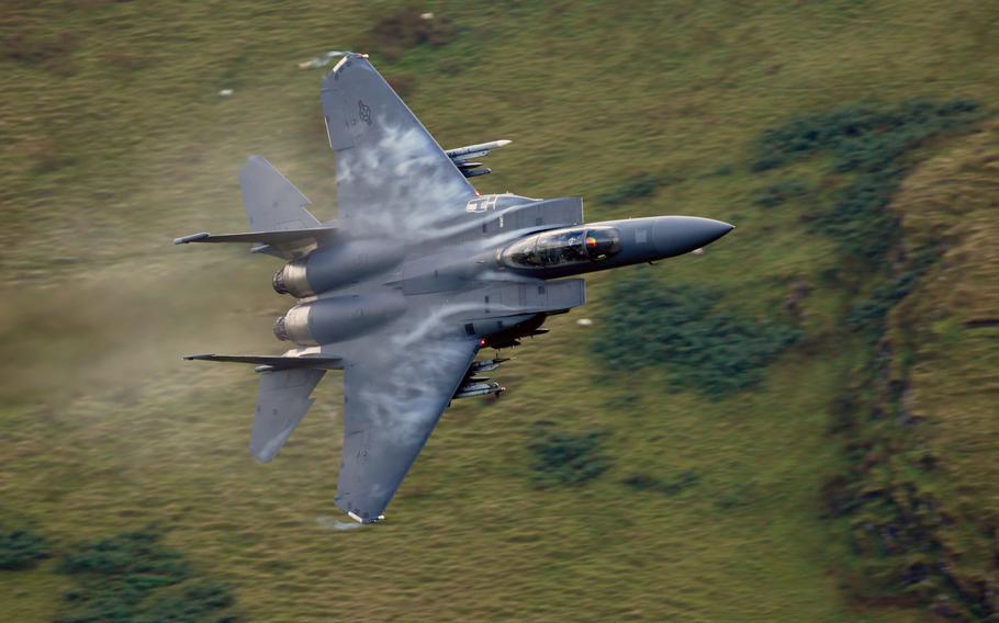 A 48th Fighter Wing F-15E Strike Eagle maneuvers through the "Mach Loop" valleys in northern Wales, Sept. 5, 2017. Two F-15s from the same unit flew dangerously close to parachutists in April 2019, prompting an investigation by UK air safety board, Airprox.