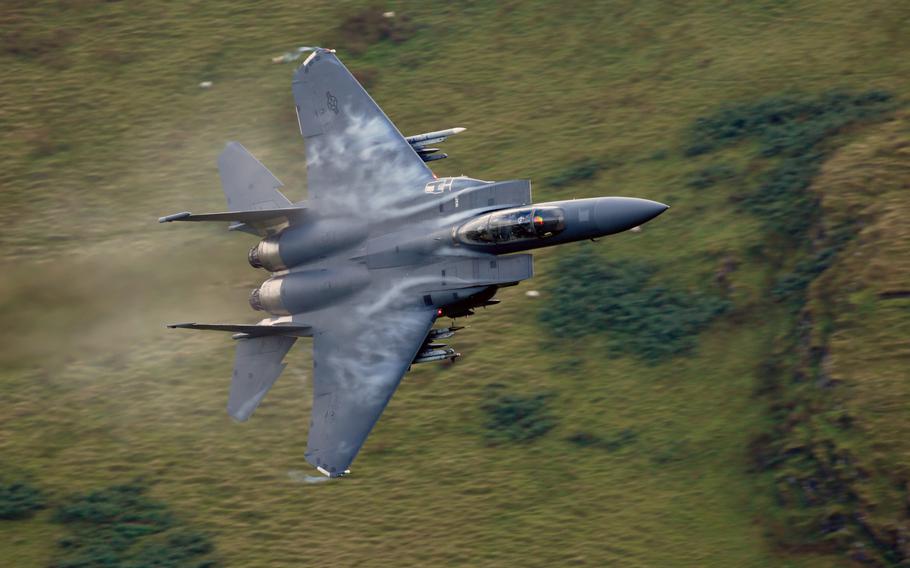 A 48th Fighter Wing F-15E Strike Eagle maneuvers through the "Mach Loop" valleys in northern Wales, Sept. 5, 2017. Two F-15s from the same unit flew dangerously close to parachutists in April 2019, prompting an investigation by UK air safety board, Airprox.