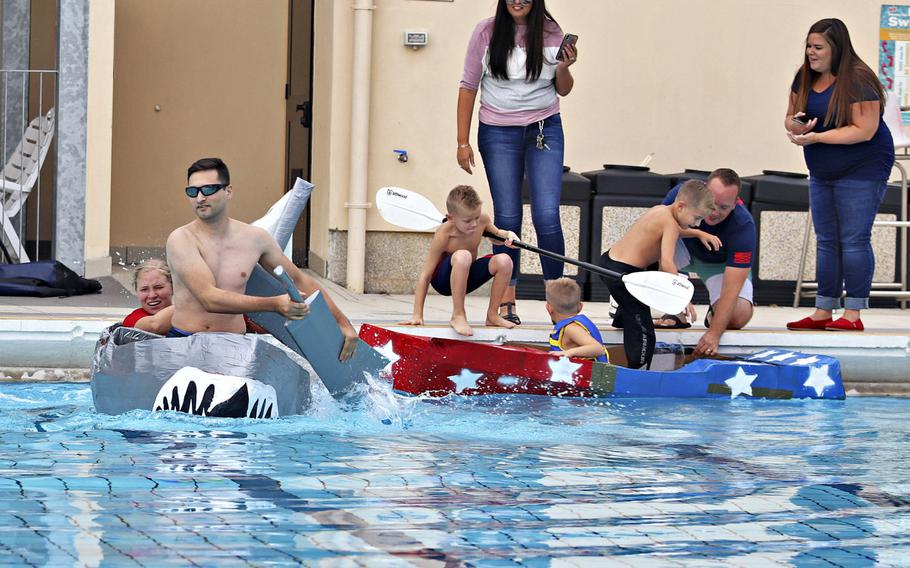 Contestants compete in the first cardboard boat race to be held at Aviano Air Base, Italy, on Sept. 19, 2019.