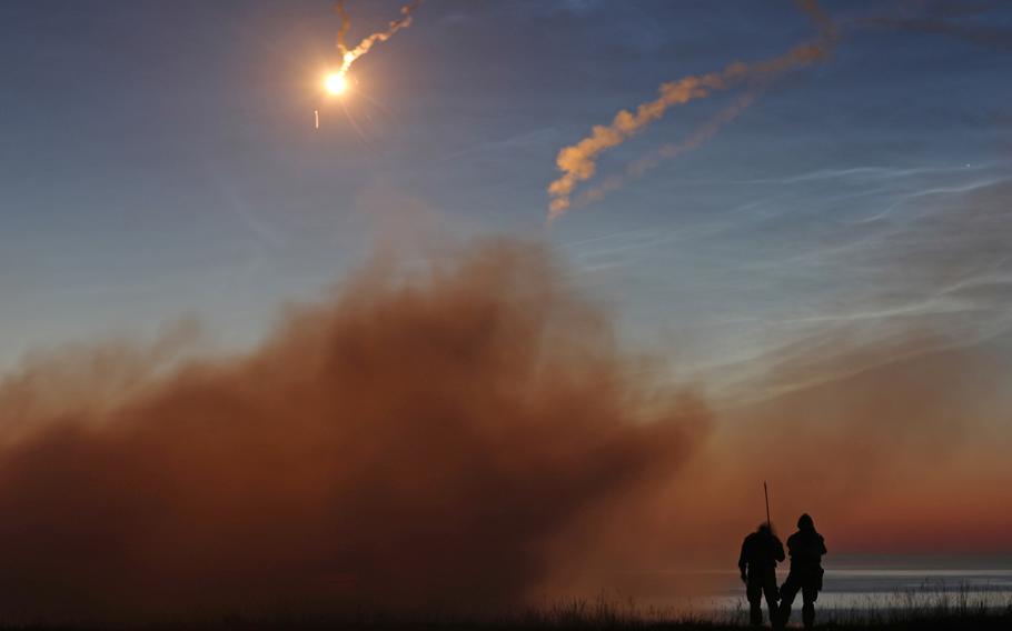 U.S. Army soldiers watch as the missile they fired from the FIM-92 Stinger missile system flies toward its target during a short-range air defense night-fire exercise in Utska, Poland, on June 17, 2019. A report by the Association of the U.S. Army's Institute of Land Warfare warns that allies might be concerned that new weapons deployments in Europe could make European populations feel they are potential targets in a future war.