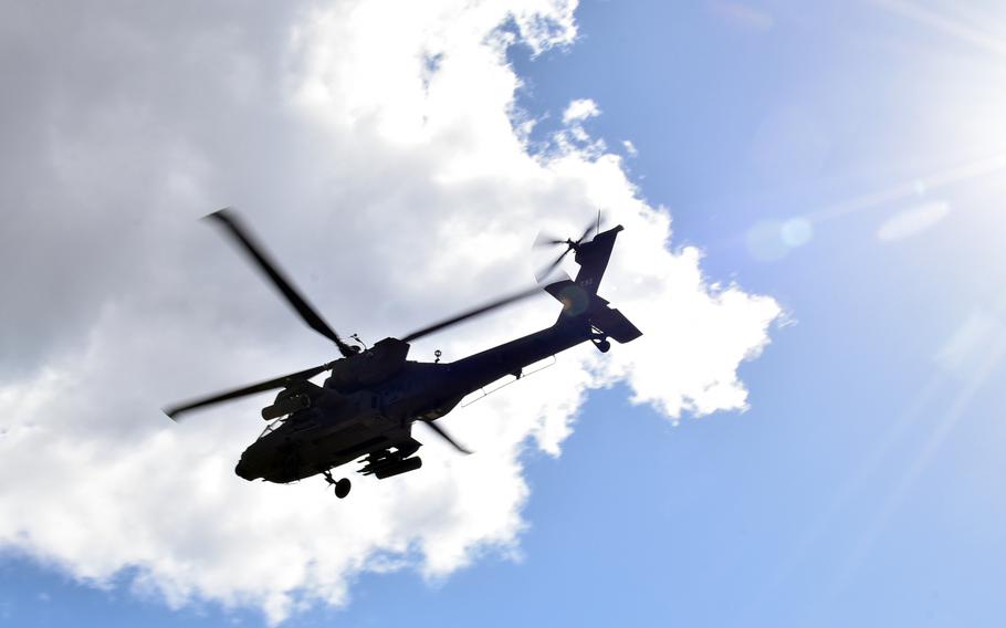 A 12th Combat Aviation Brigade AH-64 Apache helicopter, flies over Germany, in March 2019. A 12th CAB Apache cut six power lines when it made an emergency landing near the German town of Linden, Tuesday, Sept. 24, 2019.