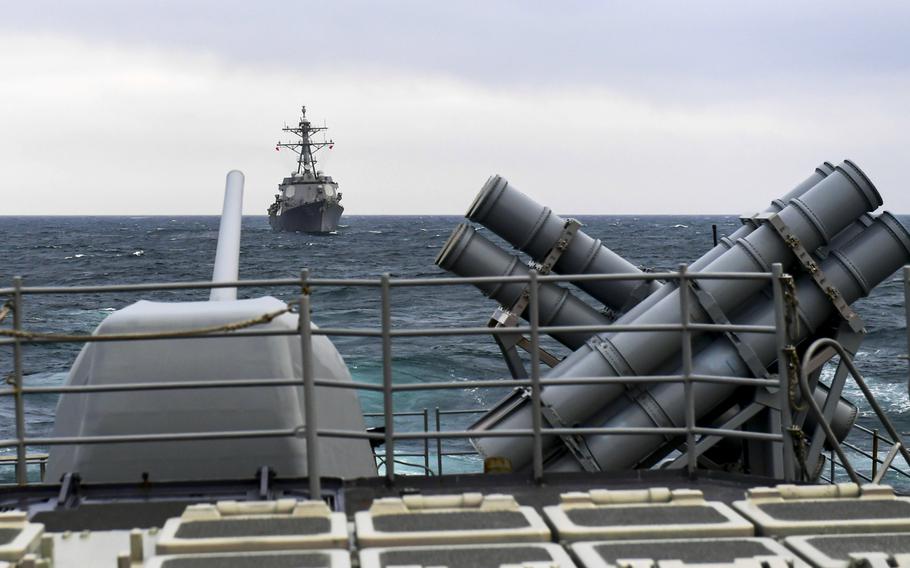 The guided-missile destroyer USS Farragut steams behind the guided-missile cruiser USS Normandy during a live-fire exercise Sept. 25, 2019, in the Artic Ocean.